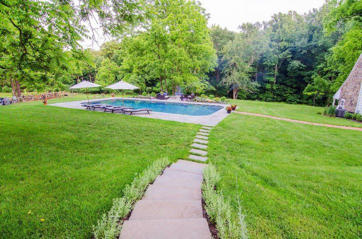 stone stairs leading to a pool